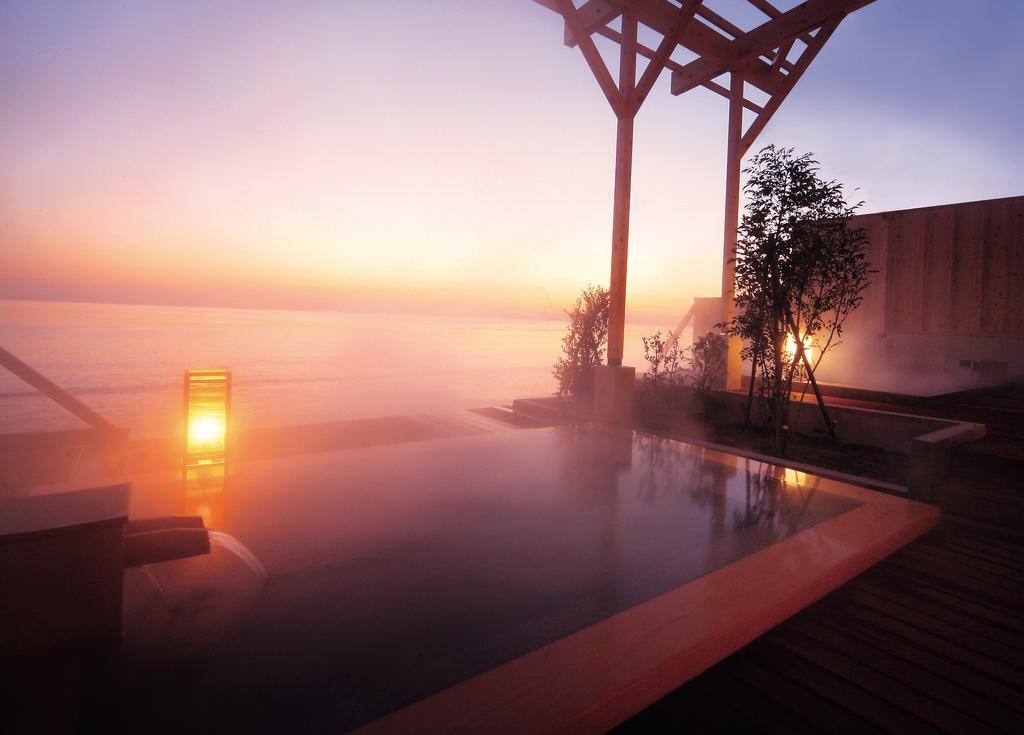 Amane Resort Seikai Beppu Extérieur photo A view of the outdoor onsen at the Hoshino Resorts Karuizawa Hika
